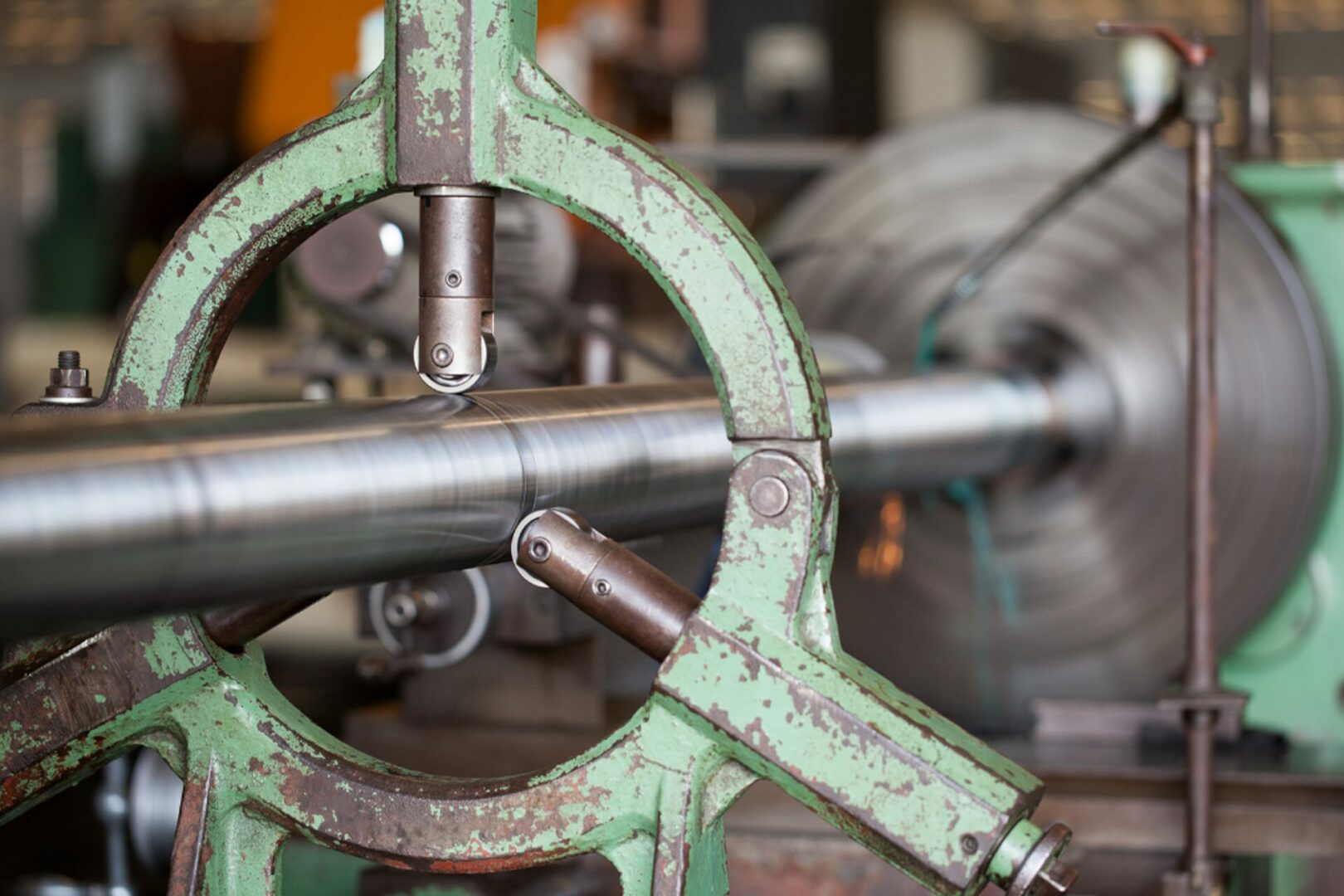Technician connecting flushing equipment to hydraulic lines.